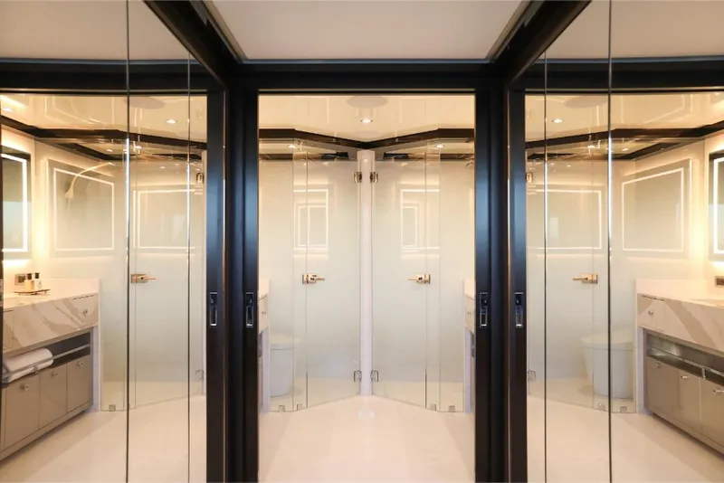 Slide: The Image of Luxurious bathroom interior of 2023 Ocean Alexander 37L yacht with mirrored glass doors. - 13