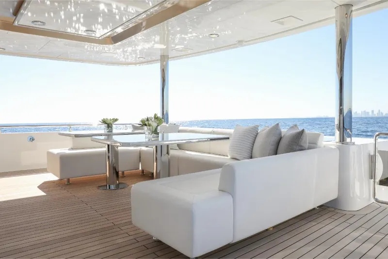 Slide: The Image of Luxury deck of 2023 Ocean Alexander 37L yacht with white seating and ocean view. - 23