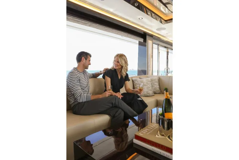 Slide: The Image of Couple enjoying luxury interior of 2023 Ocean Alexander 37L yacht. - 28