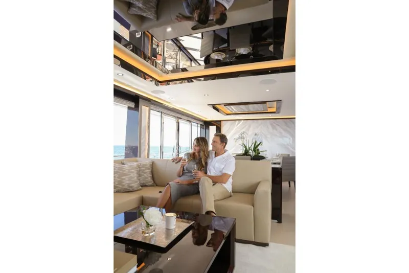 Slide: The Image of Couple relaxing in luxurious 2023 Ocean Alexander 37L yacht interior. - 29
