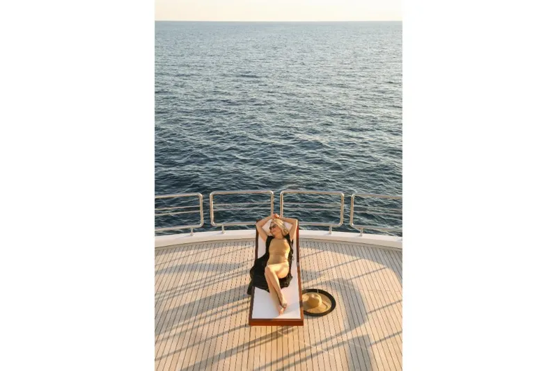Slide: The Image of Person sunbathing on Ocean Alexander 37L yacht deck, 2023 model, with ocean view. - 42