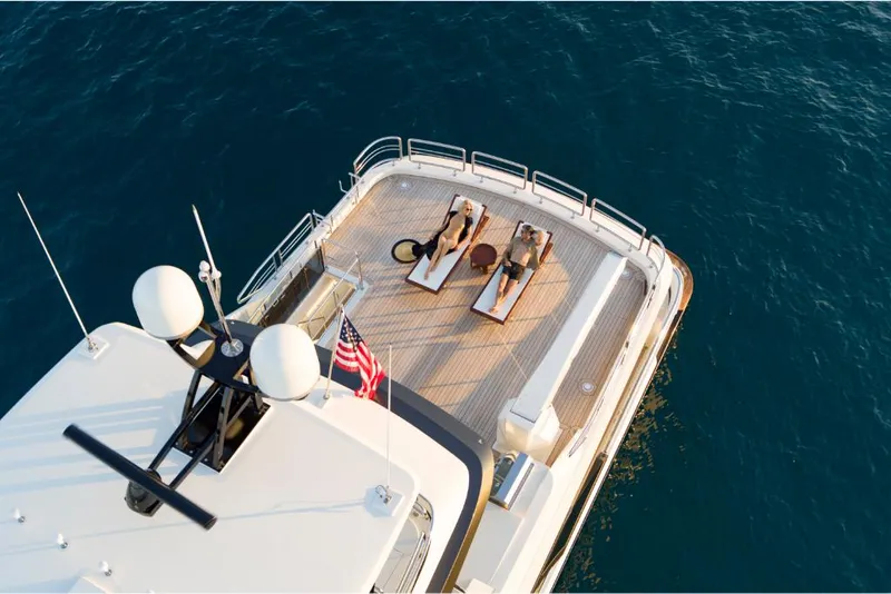 Slide: The Image of Aerial view of 2023 Ocean Alexander 37L yacht's sun deck with loungers. - 7