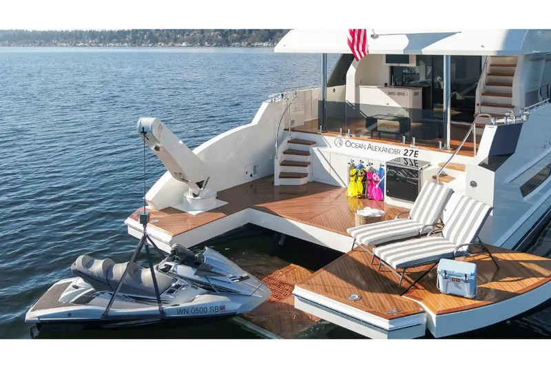 Slide: The Image of Luxury 2023 Ocean Alexander 27E yacht with jet ski and sun deck. - 11