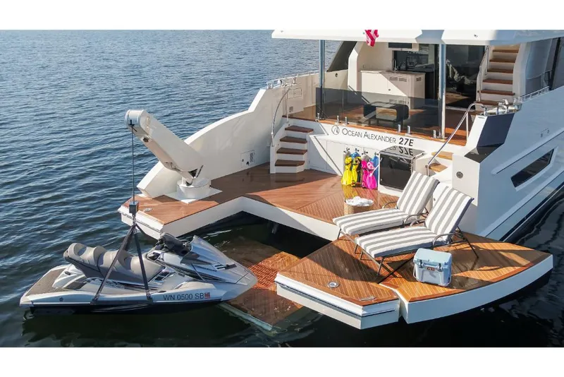 Slide: The Image of Luxury 2023 Ocean Alexander 27E yacht with jet ski and sun loungers on deck. - 12