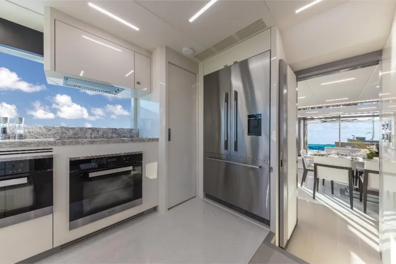 Slide: The Image of Modern kitchen interior of 2023 Ocean Alexander 27E yacht with stainless steel appliances. - 19
