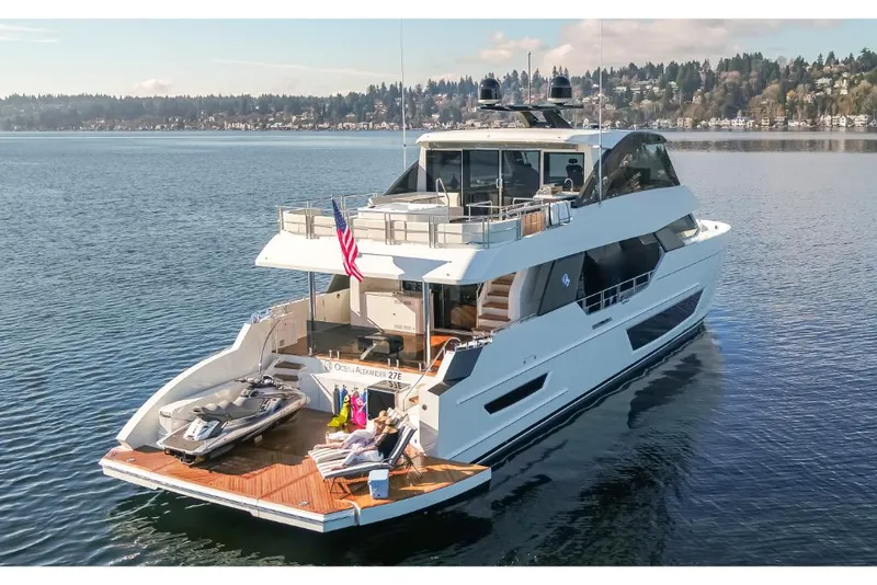 Slide: The Image of Luxury yacht Ocean Alexander 27E 2023 model cruising on a serene lake. - 4