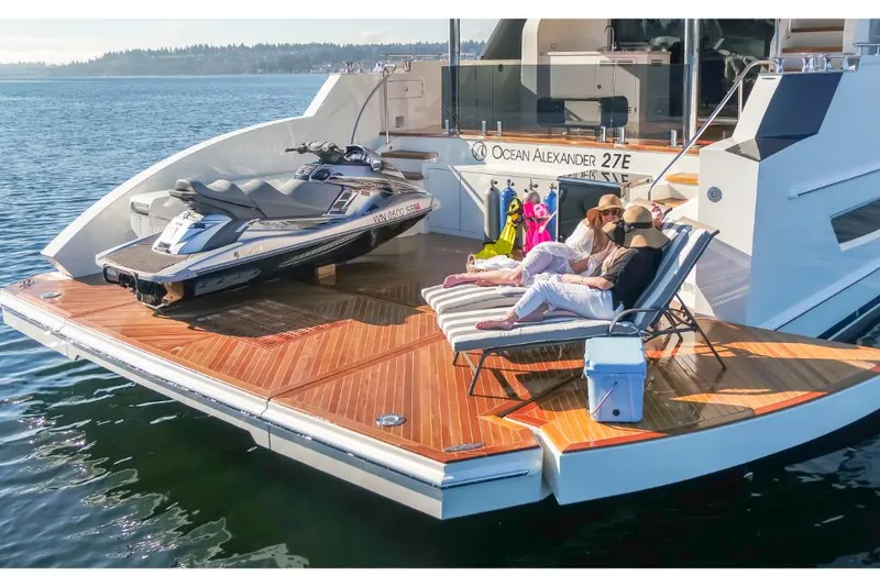 Slide: The Image of Luxury 2023 Ocean Alexander 27E yacht with sun deck and jet ski. - 5