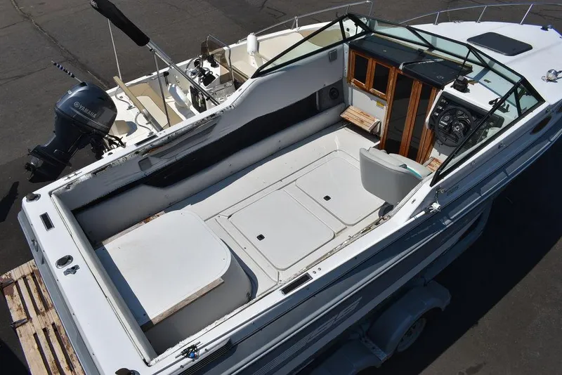 Slide: The Image of 1991 Sea Sprite 225 boat interior with Yamaha outboard motor. - 2