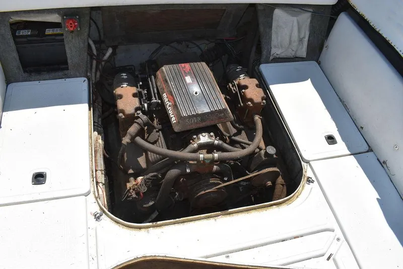 Slide: The Image of 1991 Sea Sprite 225 boat engine compartment with visible engine components. - 23