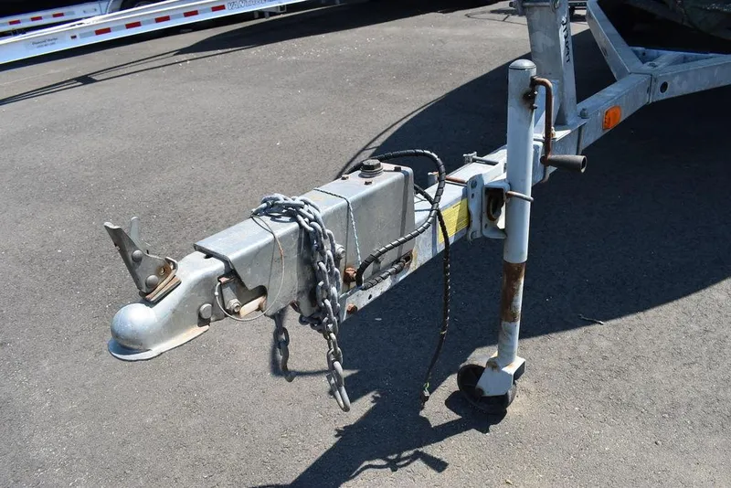 Slide: The Image of Trailer hitch of a 1991 Sea Sprite 225 boat on asphalt. - 30