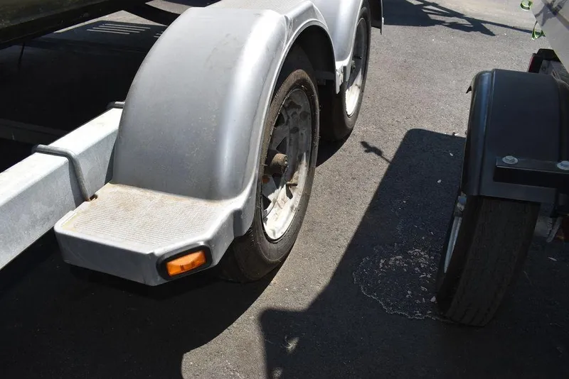 Slide: The Image of Close-up of a 1991 Sea Sprite 225 boat trailer wheel and fender. - 35