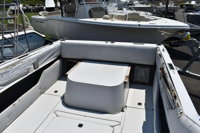 Slide: The Image of 1991 Sea Sprite 225 boat interior with seating and storage compartments. - 8