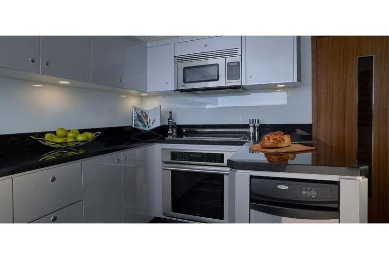 Slide: The Image of Modern kitchen in 2023 Ocean Alexander 32L yacht with stainless steel appliances. - 25