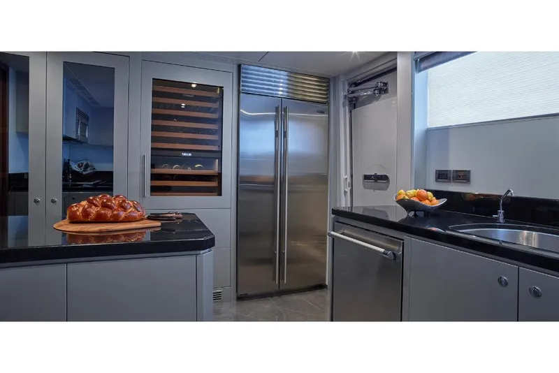 Slide: The Image of Modern kitchen in 2023 Ocean Alexander 32L yacht with stainless steel appliances. - 26