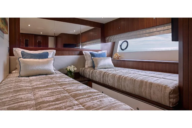 Slide: The Image of Luxury cabin interior of 2023 Ocean Alexander 32L yacht with twin beds. - 34