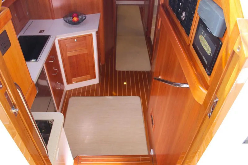 Slide: The Image of 2023 MJM 53z yacht interior with wooden cabinetry and flooring. - 17