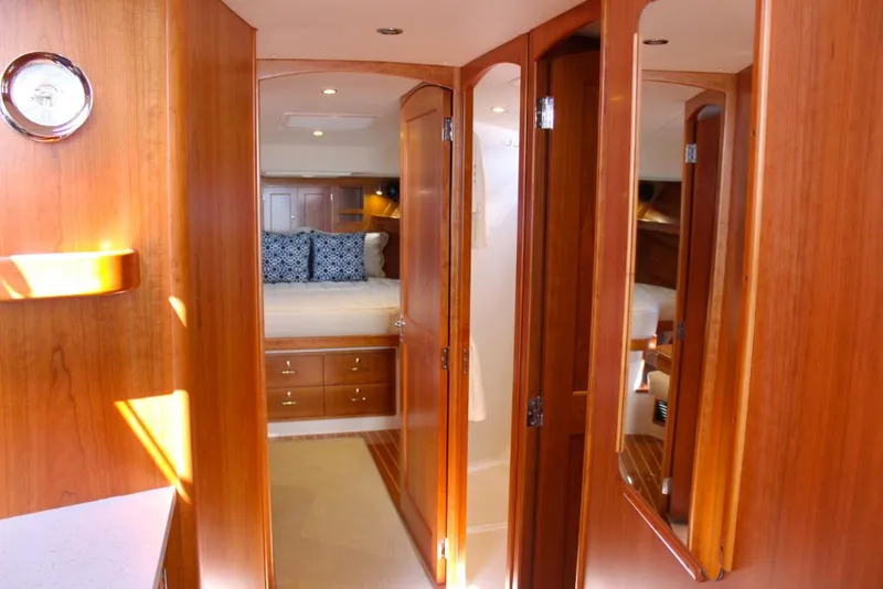 Slide: The Image of Interior cabin of 2023 MJM 53z yacht with wooden finish and cozy bedroom. - 18