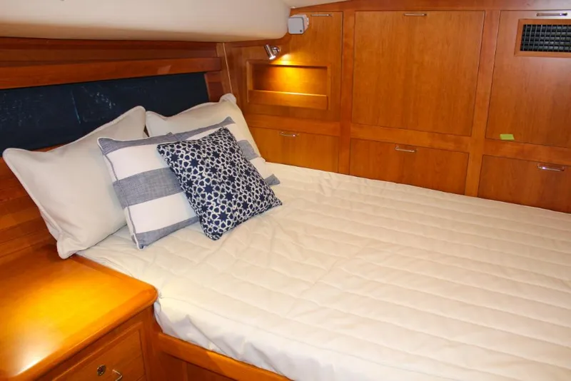 Slide: The Image of Luxurious cabin interior of 2023 MJM 53z yacht with cozy bed and wooden finish. - 20
