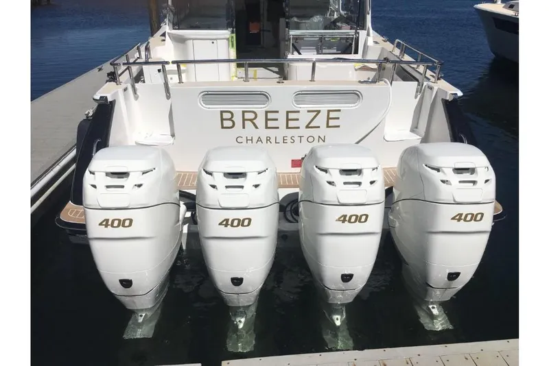 Slide: The Image of 2023 MJM 53z boat with four 400 horsepower engines, named Breeze Charleston. - 23