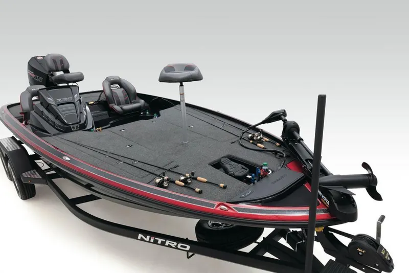 Slide: The Image of 2022 Nitro Z20 fishing boat with seats and fishing rods on trailer. - 16