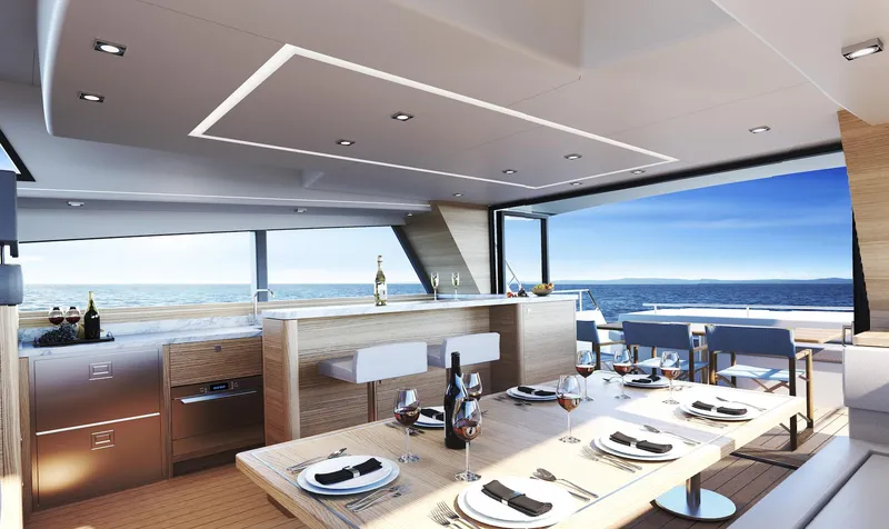 Slide: The Image of Luxurious interior of 2022 Compact Mega Yachts CMY 173 with elegant dining setup and ocean view. - 12