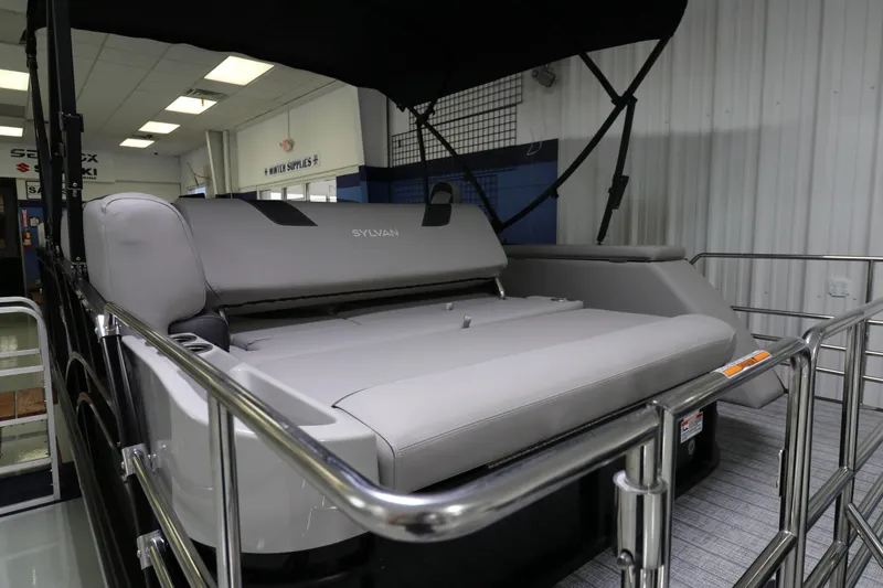 Slide: The Image of 2023 Sylvan L5 CLZ pontoon boat interior with plush seating and sleek design. - 13