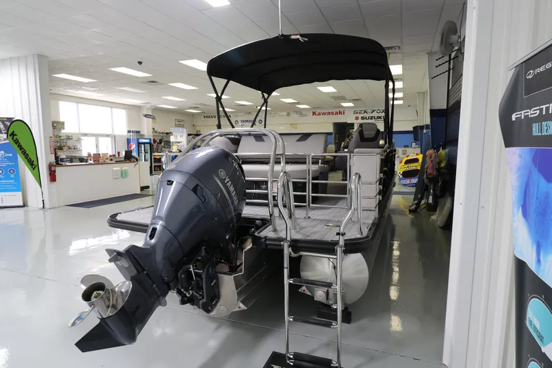 Slide: The Image of 2023 Sylvan L5 CLZ pontoon boat with outboard motor in showroom. - 15