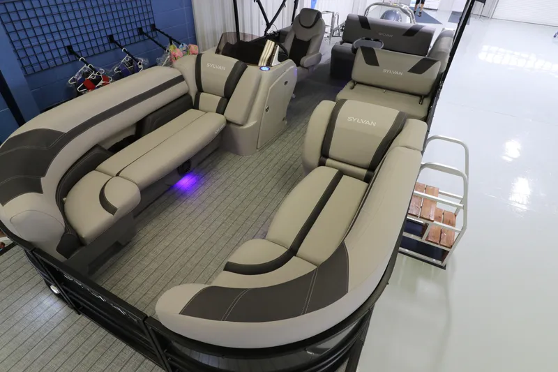 Slide: The Image of Luxurious 2023 Sylvan L5 CLZ pontoon boat interior with plush seating and modern design. - 3