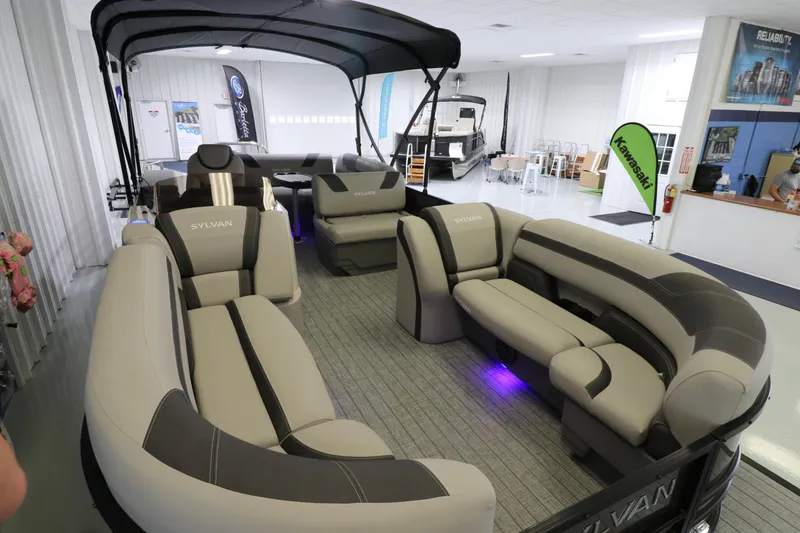 Slide: The Image of 2023 Sylvan L5 CLZ pontoon boat with spacious seating and modern interior design. - 5