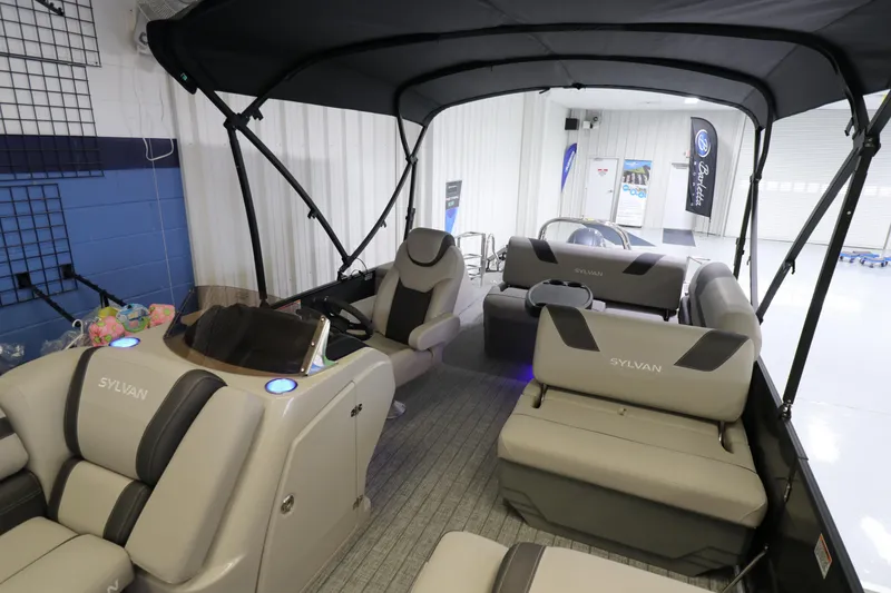 Slide: The Image of 2023 Sylvan L5 CLZ pontoon boat interior with seating and canopy. - 6