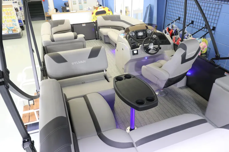 Slide: The Image of Interior of 2023 Sylvan L5 CLZ pontoon boat with modern seating and control console. - 7
