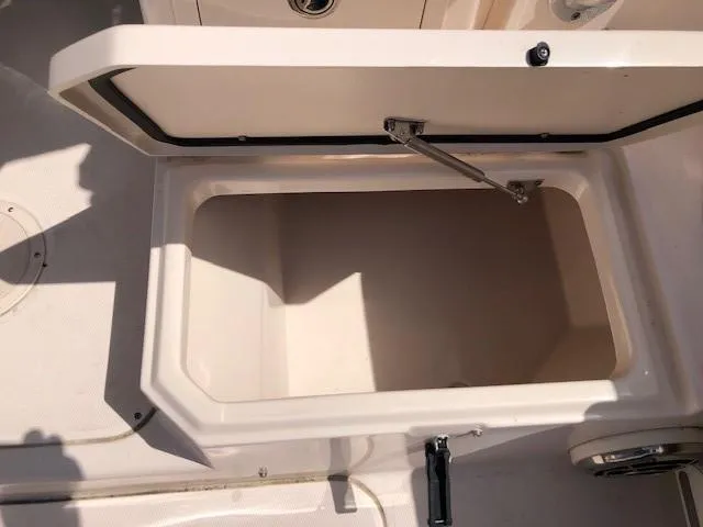 Slide: The Image of Open storage compartment on 2014 Grady-White Journey 258 boat. - 12