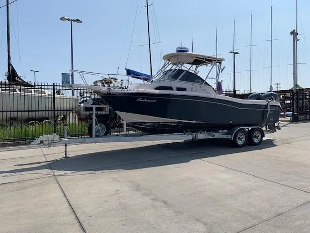 Slide: The Image of 2014 Grady-White Journey 258 boat on trailer in marina setting. - 4