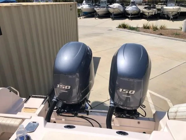 Slide: The Image of Twin Yamaha 150 engines on a 2014 Grady-White Journey 258 boat. - 6