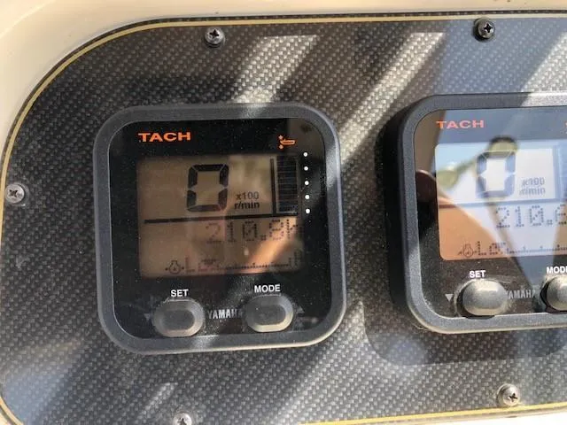 Slide: The Image of Tachometer display on 2014 Grady-White Journey 258 boat dashboard. - 9