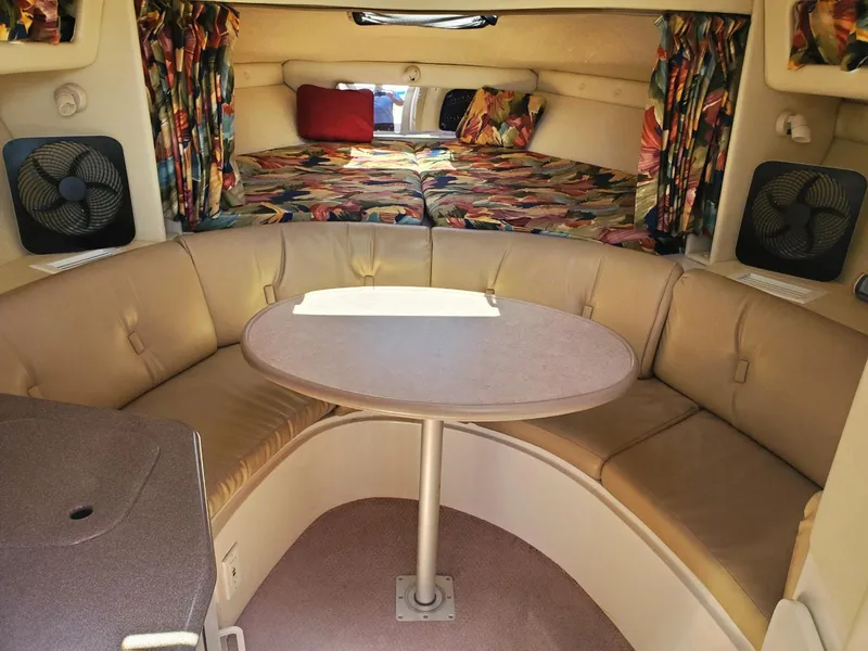 Slide: The Image of 1997 Chaparral Signature 29 cabin interior with seating area and table. - 11