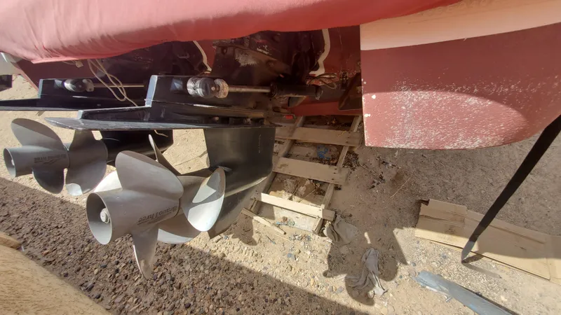 Slide: The Image of 1997 Chaparral Signature 29 boat propellers and stern drive in dry dock. - 17