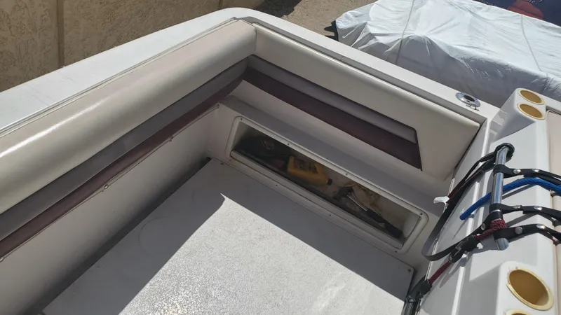 Slide: The Image of 1997 Chaparral Signature 29 boat interior with storage compartment and seating. - 19