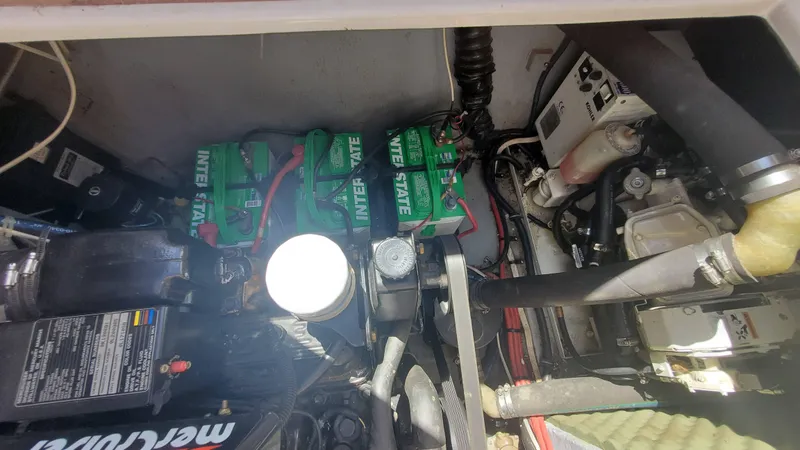 Slide: The Image of Engine compartment of a 1997 Chaparral Signature 29 boat with Interstate batteries. - 22