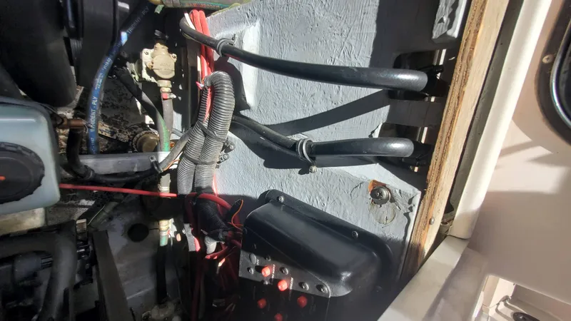 Slide: The Image of 1997 Chaparral Signature 29 engine compartment with wiring and hoses. - 23