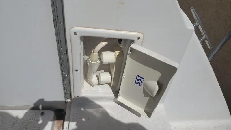 Slide: The Image of 1997 Chaparral Signature 29 boat utility compartment with open access panel. - 37