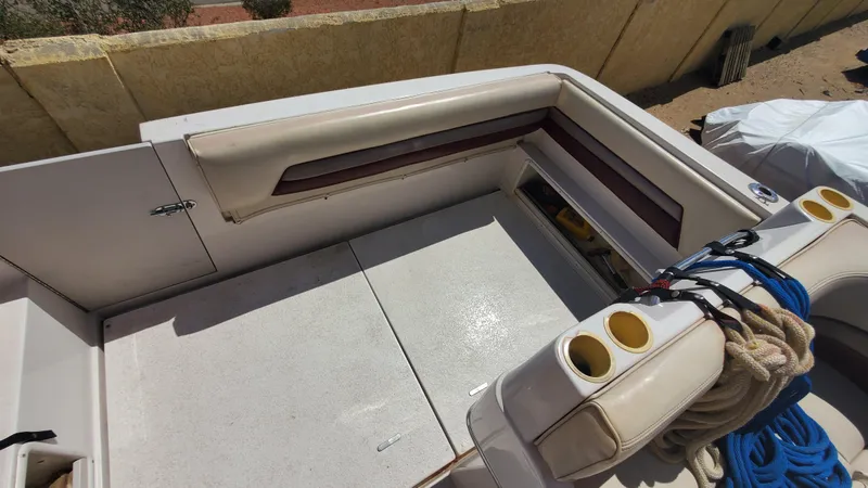 Slide: The Image of 1997 Chaparral Signature 29 boat interior with seating and storage compartments. - 39