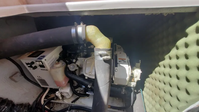 Slide: The Image of 1997 Chaparral Signature 29 engine compartment with hoses and components. - 40