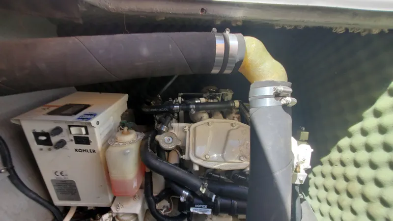 Slide: The Image of Engine compartment of a 1997 Chaparral Signature 29 boat with Kohler generator. - 41