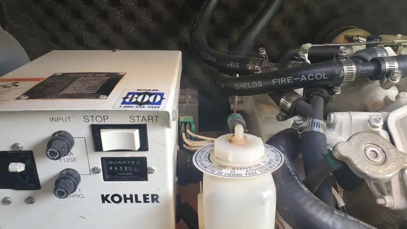 Slide: The Image of Kohler generator in a 1997 Chaparral Signature 29 boat engine compartment. - 42