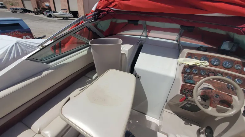 Slide: The Image of 1997 Chaparral Signature 29 boat interior with red canopy and control panel. - 47