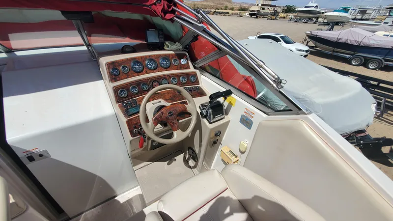 Slide: The Image of 1997 Chaparral Signature 29 boat helm with steering wheel and instrument panel. - 48