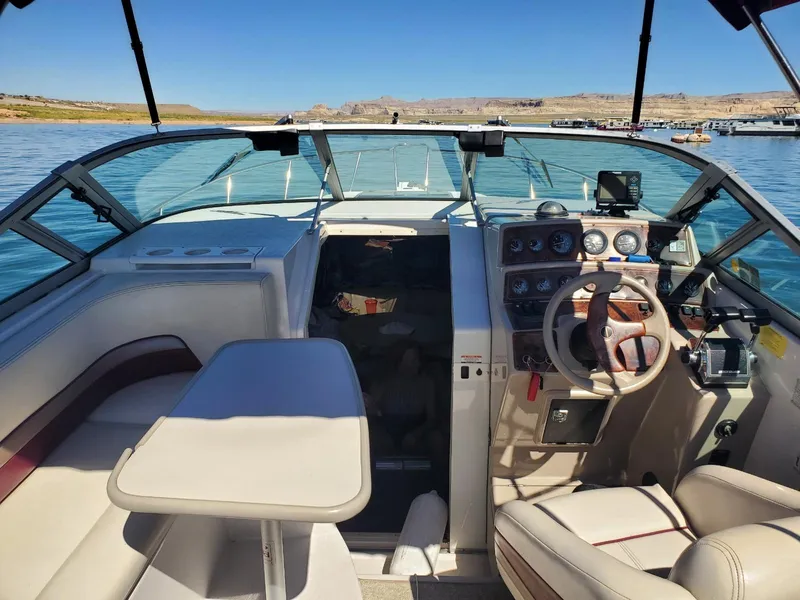 Slide: The Image of 1997 Chaparral Signature 29 boat interior with steering wheel and seating area. - 5