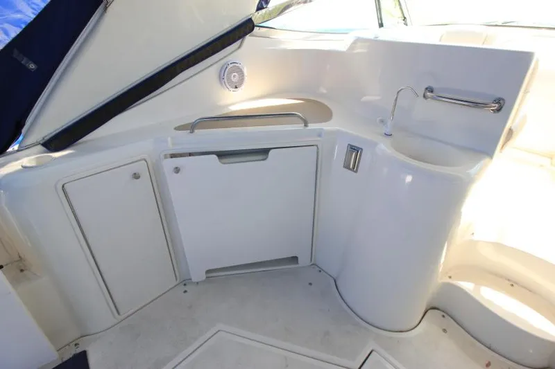 Slide: The Image of 2000 Cruisers Yachts 3870 Express interior with sink and storage cabinets. - 11