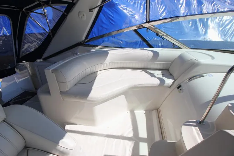 Slide: The Image of 2000 Cruisers Yachts 3870 Express interior with white leather seating and panoramic windows. - 17
